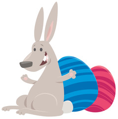 cartoon Easter bunny with colored eggs
