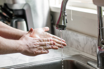 Washing Hands with Soap at Sink