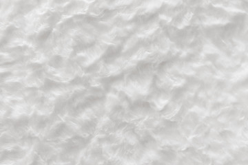 White real wool with a white top texture background, light natural sheep  wool, white seamless cotton, fluffy fur texture for designers, close-up white wool rug