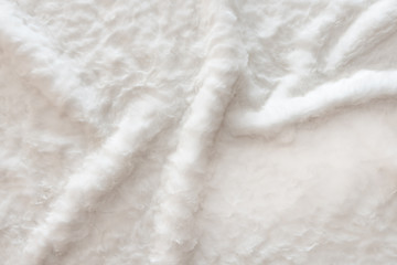 White real wool with a white top texture background, light natural sheep  wool, white seamless cotton, fluffy fur texture for designers, close-up white wool rug