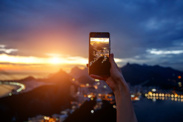 Taking a photo on a mobile phone camera of Rio de Janeiro, Brasil.
