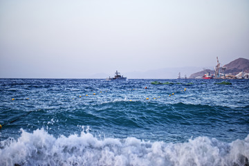 A war ship dealing with big waves at the The redsea of Eilat, Israel.