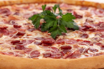 Tasty Italian pizza with mozzarella and sausages