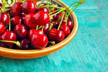 sweet cherry on a turquoise background