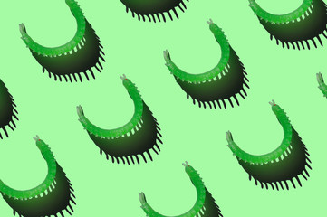 Centipede. Insect. Green rubber toy. Hard shadows.