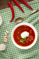 Red borsch. Ukrainian food. Rustic style. Red beetroot soup with beetroot, served with sour cream and garlic.