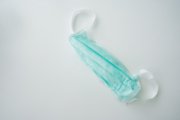 Disposable breath filter face mask with earloop. Protective mask on white background. Symbol of...