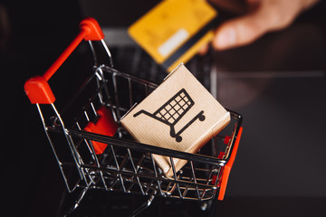 Boxes in a trolley on a laptop keyboard. Ideas about online shopping, online shopping is a form of...
