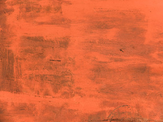 An old rusty iron wall painted with large spots