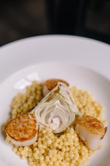 A white plate topped with different types of food