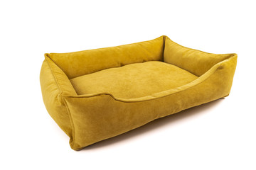 Yellow soft small dog or cats bed. Angle view.