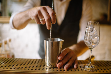 barmen preparing mint spritz cocktail