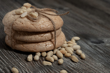 oatmeal cookies with pine nuts, on a wooden table close-up