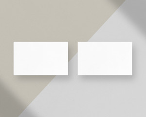 Mockup of two vertical business cards. Blank white business cards mockups with shadow Overlays. Photo mockup with clipping path.