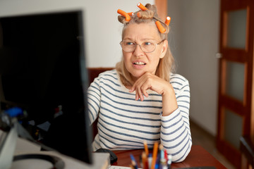 Lady searching information on internet or communicating online