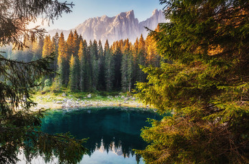 Incredible view on Lago di Carezza Karersee , a Beautiful Lake in the Dolomites alps, Italy. Amazing nature landscape.