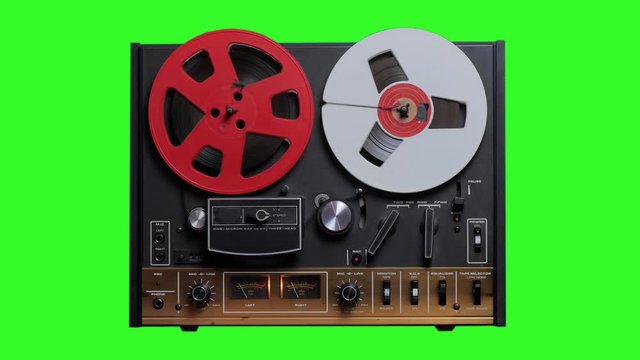 Retro reel to reel tape machine rolling with green screen to use it on your own compositions