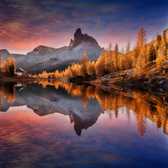  Scenic image of Fairy-tale Landscape with colorful overcast sky under sunlit, over the  Federa...