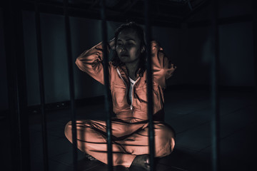 Portrait of women desperate to catch the iron prison,prisoner concept,thailand people,Hope to be...