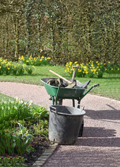 wheelbarrow and garden tools