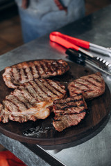 juicy meat steaks are waiting to be served on the dishes