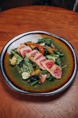 tuna salad with vegetables on a nice plate