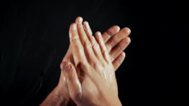 Washing hands concept, male rubs in soap 