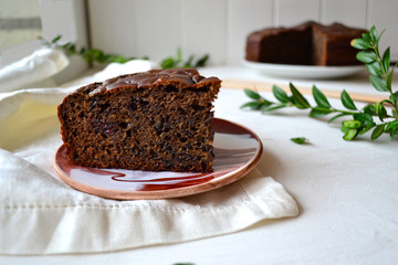 Home made chocolate pie with raisins on a white background in the kitchen