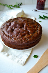 Home made chocolate pie with raisins on a white background in the kitchen