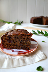 Home made chocolate pie with raisins on a white background in the kitchen