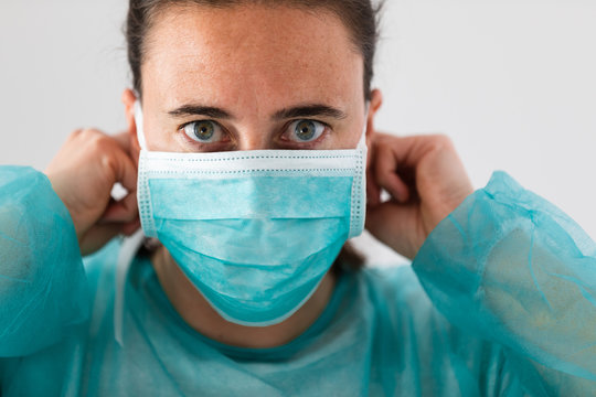 Woman Doctor Putting On Protective Mask Against Coronavirus. Preventive Team Medical Personnel Panorama Banner.