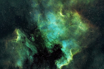 Fototapeta na wymiar Beautiful space nebula of green color. Elements of this image were furnished by NASA.