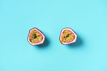 Yellow maracuya on blue background. Top view. Copy space. Passion fruit. Creative design banner....