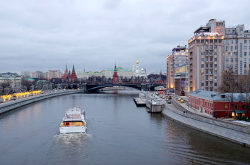 Fototapeta na wymiar Moscow, Russia - January 10, 2020: Evening view of the Moscow Kremlin, Prechistenskaya and Bersenevskaya embankments
