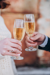 the bride and groom are holding glasses of champagne
