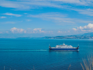 Obraz premium Greece, Corfu island. A beach with crystal clear azure water and a white beach in picturesque landscapes - the paradise coastline of the island of Corfu in Paleokastritsa, Ionian archipelago
