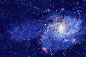 A beautiful blue galaxy in deep space. Elements of this image furnished by NASA