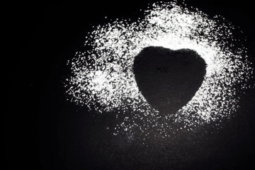 Trace of powdered sugar from a heart-shaped biscuit