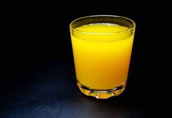 A glass of fresh tangerine juice
