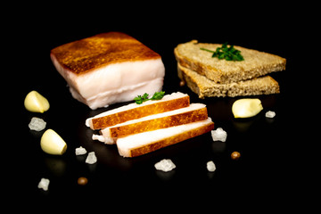 Slicing pork fat on a wood board