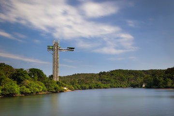 Long exposure Landscape image of Mayem Lake in Goa with the bungee jumping structure on display,...