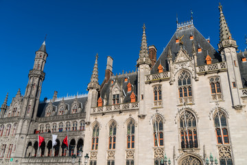 Fototapeta na wymiar The Grote Markt, the Provinciaal Hof gothic building, and Historium building in Bruges, Belgium