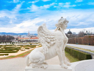 Obraz premium Old sculpture with Vienna city view in Belvedere park. Austria. Wien. Europe