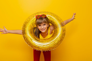 Little girl playing with inflatable swim ring