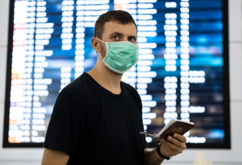 Caucasian man wearing a protective mask against coronavirus. Facial hygienic mask for safety outdoor. Environmental awareness or virus spread concept. Coronavirus contagion fear concept