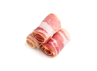 Slices of bacon on a white background. Raw rolled bacon on a white background.