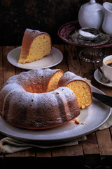 Bundt Cake perfect for parties, breakfast or dessert. Classic Vanilla Bundt Cake. Lemon Butter Bundt Cake served with cup of coffee.