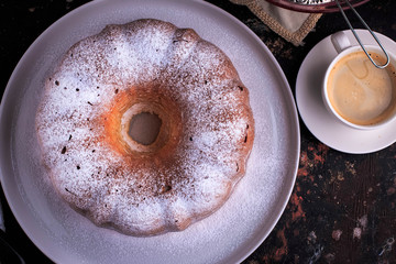 Bundt Cake perfect for parties, breakfast or dessert. Classic Vanilla Bundt Cake. Lemon Butter Bundt Cake served with cup of coffee.