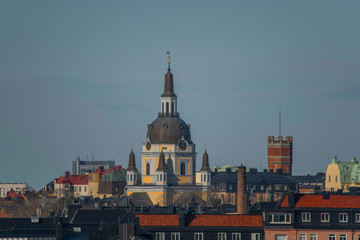 Fototapeta na wymiar Sky line over the district Södermalm with the church Katarina kyrka and the water tower at Mosebacke in the background.
