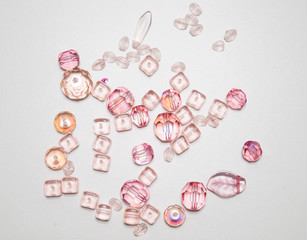 pink beads randomly on table